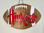 Load image into Gallery viewer, HUSKERS Football Shape Door Hanger
